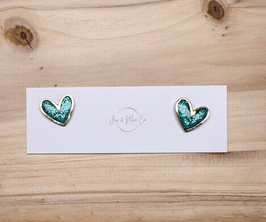 Blue glitter mini heart studs - gold trim