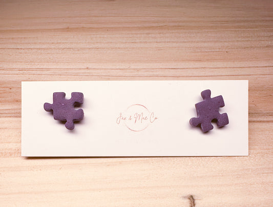 Purple puzzle piece studs